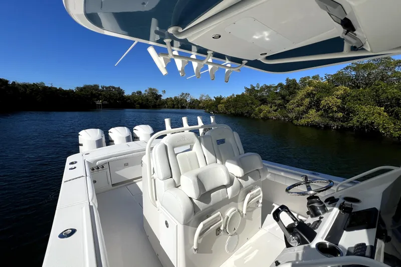  Yacht Photos Pics 2018 Regulator 34 Center Console boat on a scenic waterway.