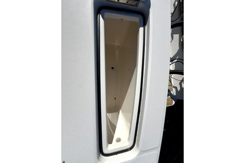  Yacht Photos Pics 2018 Regulator 34 Center Console storage compartment, open and empty.