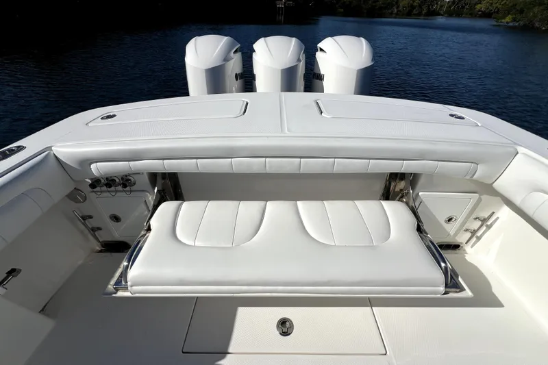  Yacht Photos Pics 2018 Regulator 34 Center Console boat interior with white seating and triple engines.