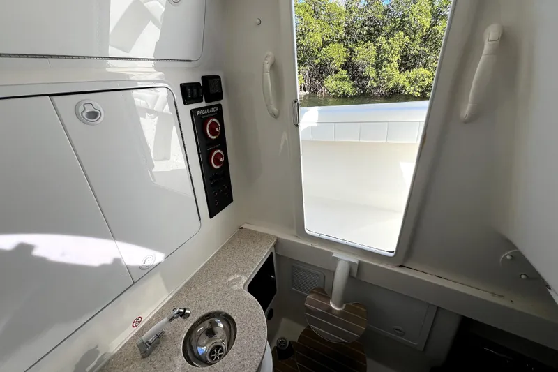  Yacht Photos Pics Interior of 2018 Regulator 34 Center Console boat with sink and control panel.