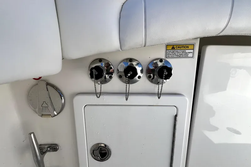  Yacht Photos Pics 2018 Regulator 34 Center Console boat controls and caution label detail.