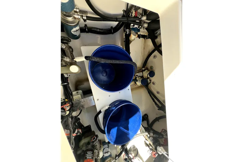  Yacht Photos Pics Engine compartment of 2018 Regulator 34 Center Console with blue buckets and wiring.