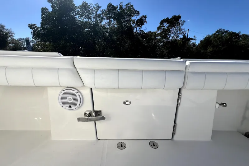  Yacht Photos Pics 2018 Regulator 34 Center Console boat interior with white seating and speaker.