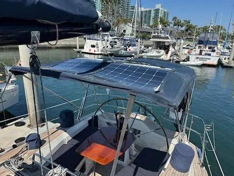 Hasard III Yacht Photos Pics 1986 Baltic 48 DP sailboat with solar panels docked in a marina.