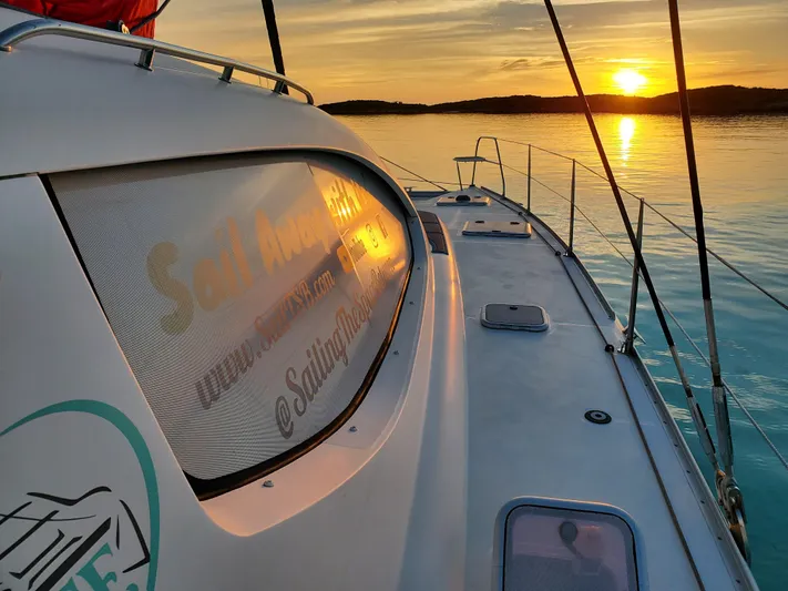  Yacht Photos Pics Sailing yacht Leopard 46 at sunset on calm waters, 2011 model.