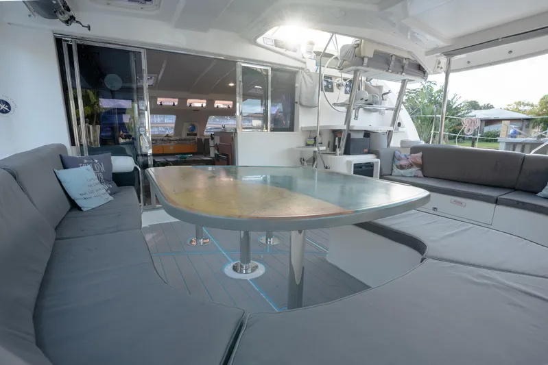  Yacht Photos Pics Spacious Leopard 46 catamaran cockpit with cushioned seating and dining table, 2011 model.
