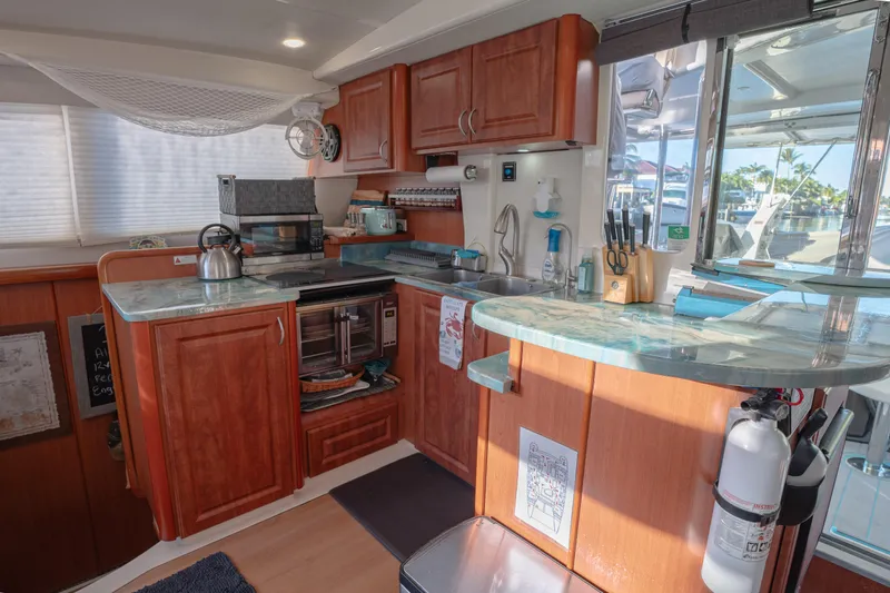  Yacht Photos Pics Luxurious Leopard 46 yacht kitchen with wooden cabinets and modern appliances, 2011 model.