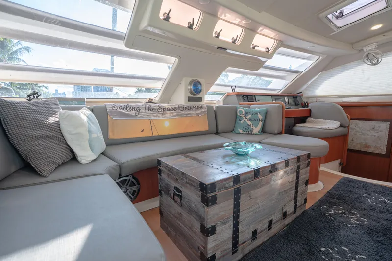  Yacht Photos Pics Luxurious interior of 2011 Leopard 46 yacht with cozy seating and decorative accents.