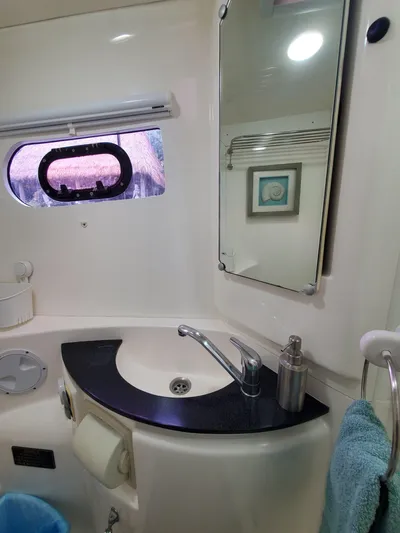  Yacht Photos Pics Bathroom interior of a 2011 Leopard 46 yacht with sink and mirror.