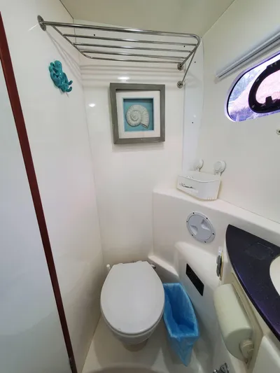  Yacht Photos Pics Compact bathroom in a 2011 Leopard 46 yacht with modern fixtures and nautical decor.