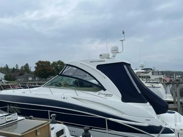  Yacht Photos Pics 2012 Cruisers Yachts 380 Express docked, featuring sleek design and navy canopy.