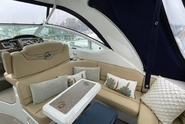  Yacht Photos Pics 2012 Cruisers Yachts 380 Express interior with beige seating and decorative pillows.