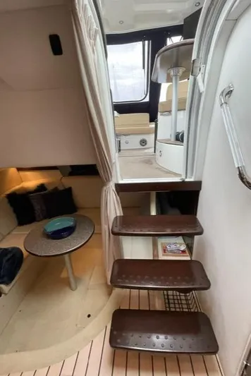  Yacht Photos Pics Interior of 2012 Cruisers Yachts 380 Express, featuring stairs and cozy seating area.