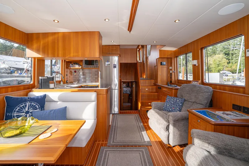 Northern Reign Yacht Photos Pics Interior of 2020 North Pacific 45 Pilothouse with wood finish and modern amenities.
