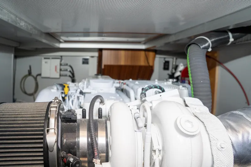 Northern Reign Yacht Photos Pics Engine room of 2020 North Pacific 45 Pilothouse yacht, showcasing mechanical components.