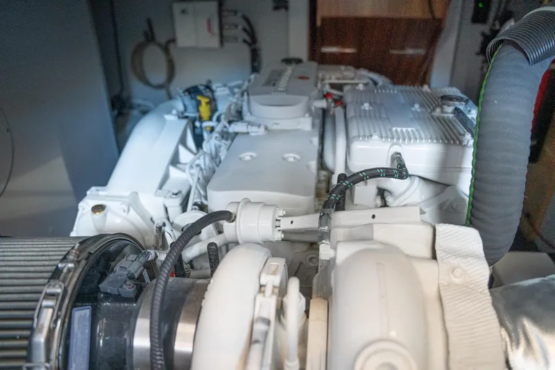 Northern Reign Yacht Photos Pics Engine room of 2020 North Pacific 45 Pilothouse yacht, showcasing detailed machinery components.