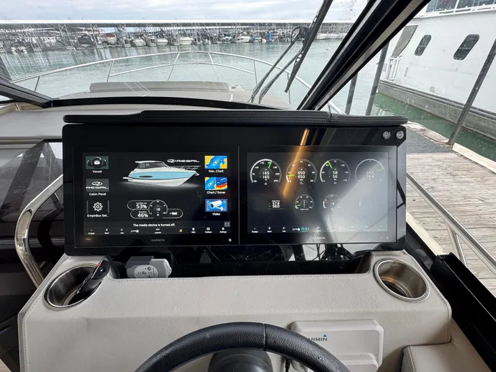  Yacht Photos Pics 2023 Regal 360 Grande Coupe dashboard with dual digital displays at marina.