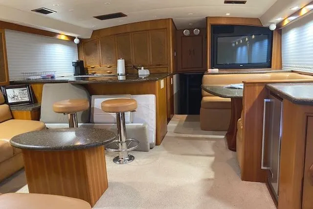 Swamp Fox Yacht Photos Pics Interior of a 1989 Buddy Davis 61 Sportfish yacht with modern furnishings and wood accents.