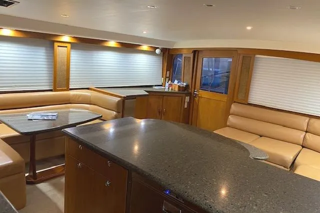 Swamp Fox Yacht Photos Pics Luxurious interior of 1989 Buddy Davis 61 Sportfish yacht with leather seating and modern finishes.