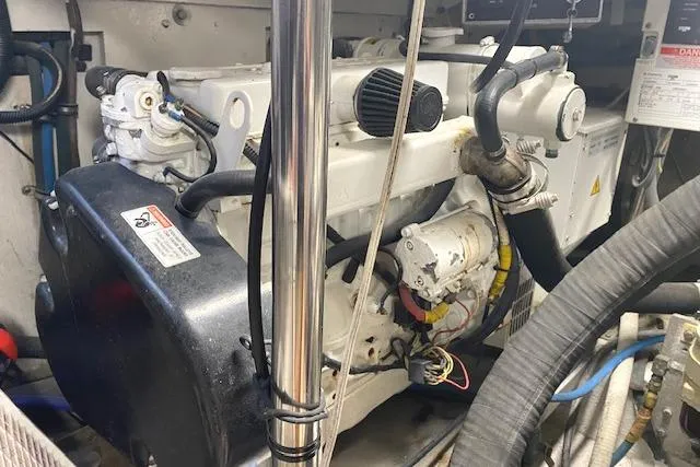 Swamp Fox Yacht Photos Pics Engine room of 1989 Buddy Davis 61 Sportfish boat, showcasing mechanical components and wiring.