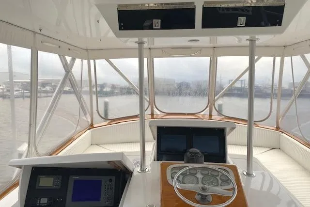 Swamp Fox Yacht Photos Pics 1989 Buddy Davis 61 Sportfish helm with navigation equipment and panoramic windows.