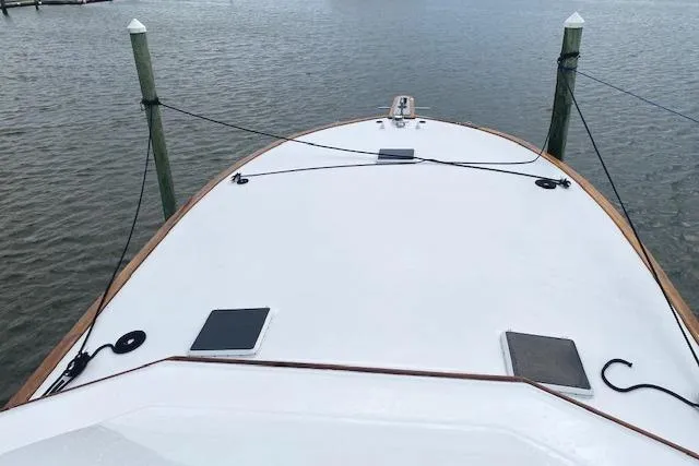 Swamp Fox Yacht Photos Pics Bow view of 1989 Buddy Davis 61 Sportfish yacht docked at marina.