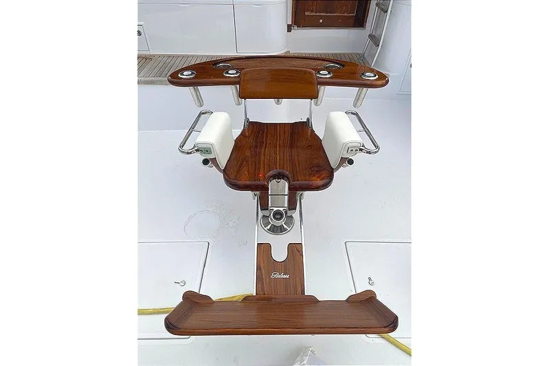 Swamp Fox Yacht Photos Pics Cockpit of 1989 Buddy Davis 61 Sportfish with polished wood fighting chair.