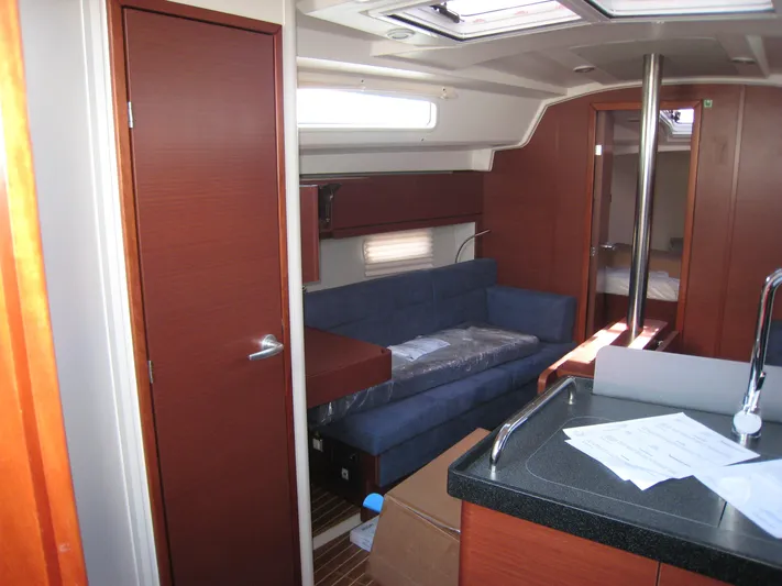 In Stock Yacht Photos Pics Interior of 2025 Hanse 348 yacht with modern furnishings and sleek design.