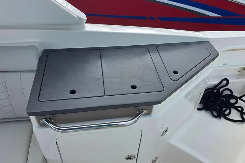  Yacht Photos Pics 2021 Sea Ray SDX 290 Outboard boat interior with storage compartment and rope.