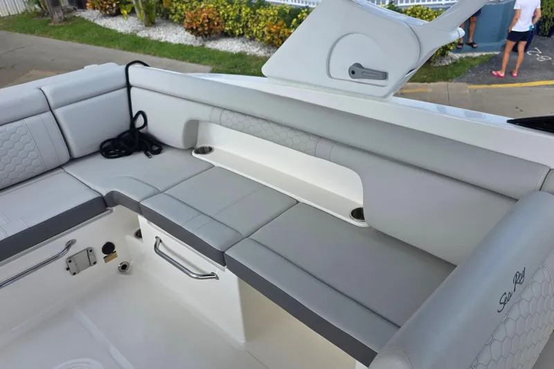  Yacht Photos Pics 2021 Sea Ray SDX 290 Outboard boat interior with gray seating and storage compartments.
