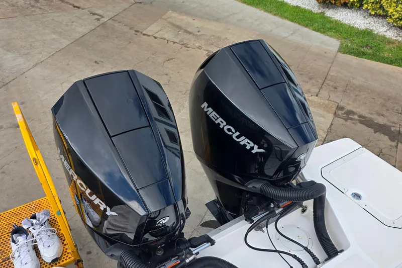  Yacht Photos Pics Twin Mercury outboard engines on a 2021 Sea Ray SDX 290 boat, dockside view.