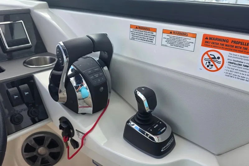  Yacht Photos Pics Control panel of 2021 Sea Ray SDX 290 Outboard with joystick and throttle controls.