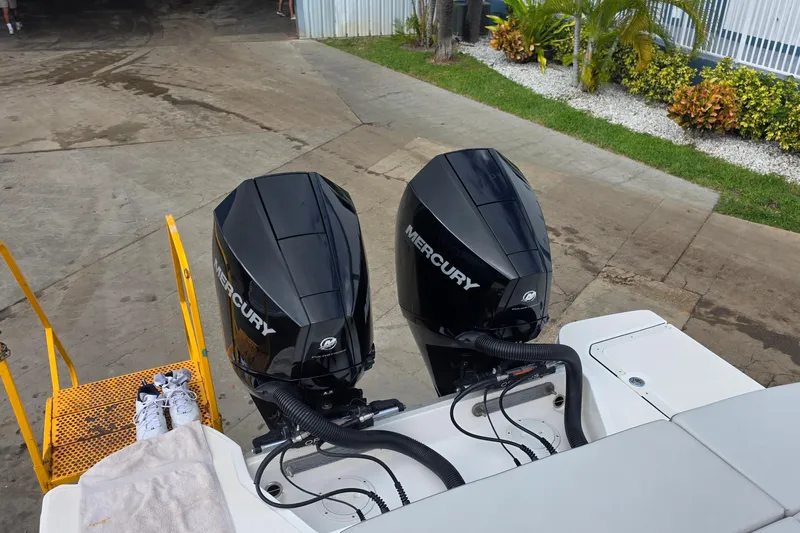  Yacht Photos Pics 2021 Sea Ray SDX 290 Outboard with dual Mercury engines, docked near greenery.