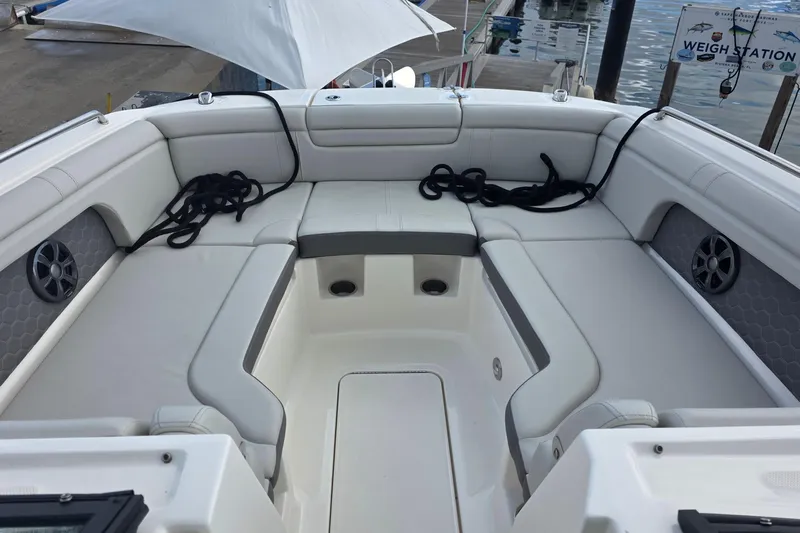  Yacht Photos Pics 2021 Sea Ray SDX 290 Outboard boat interior with white seating and speakers.
