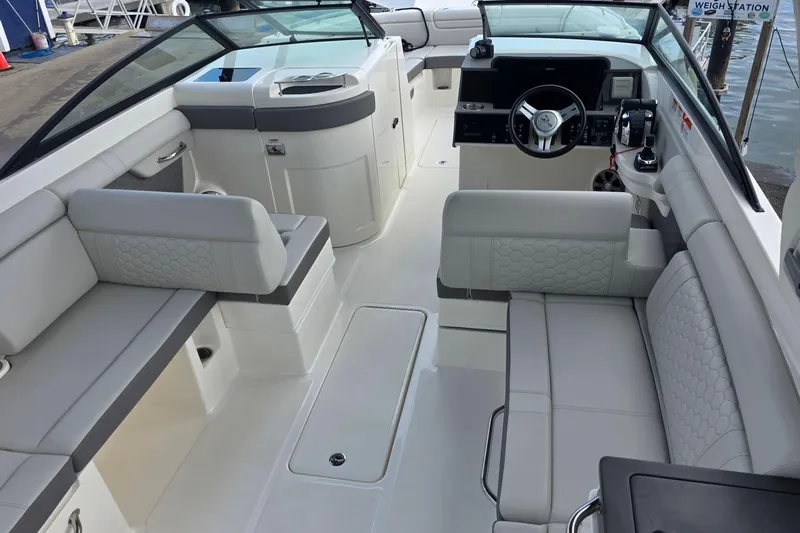 Yacht Photos Pics 2021 Sea Ray SDX 290 Outboard boat interior with luxurious seating and modern dashboard.