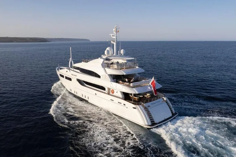 Titian Pearl Yacht Photos Pics Luxurious 2001 CRN Magnifica yacht cruising on open sea.