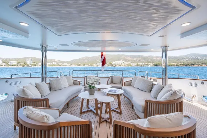 Titian Pearl Yacht Photos Pics Luxurious CRN Magnifica 2001 yacht deck with elegant seating and scenic ocean view.