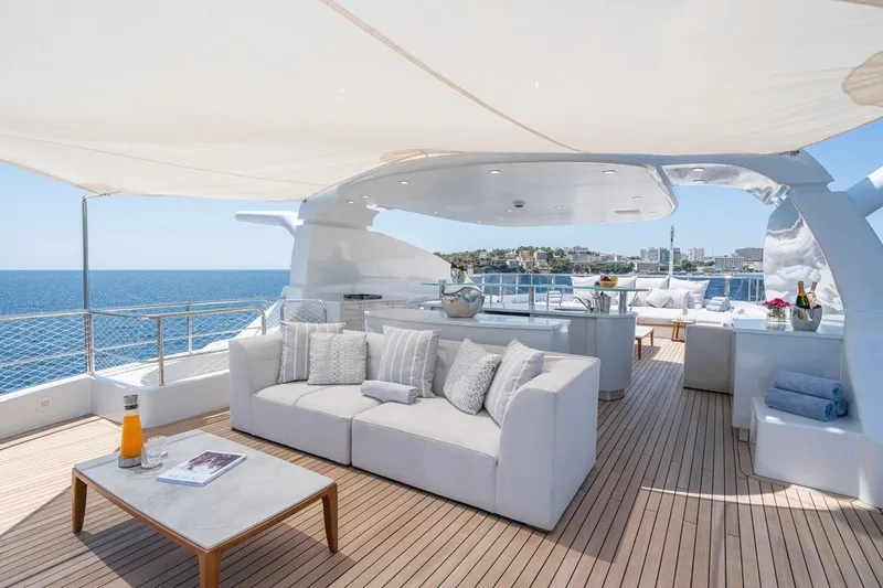 Titian Pearl Yacht Photos Pics Luxurious CRN Magnifica 2001 yacht deck with elegant seating and ocean view.