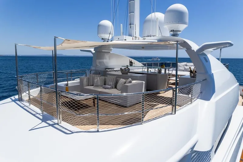 Titian Pearl Yacht Photos Pics Luxurious 2001 CRN Magnifica yacht deck with elegant seating and ocean view.