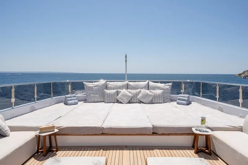 Titian Pearl Yacht Photos Pics Luxurious CRN Magnifica 2001 yacht deck with plush seating and ocean view.