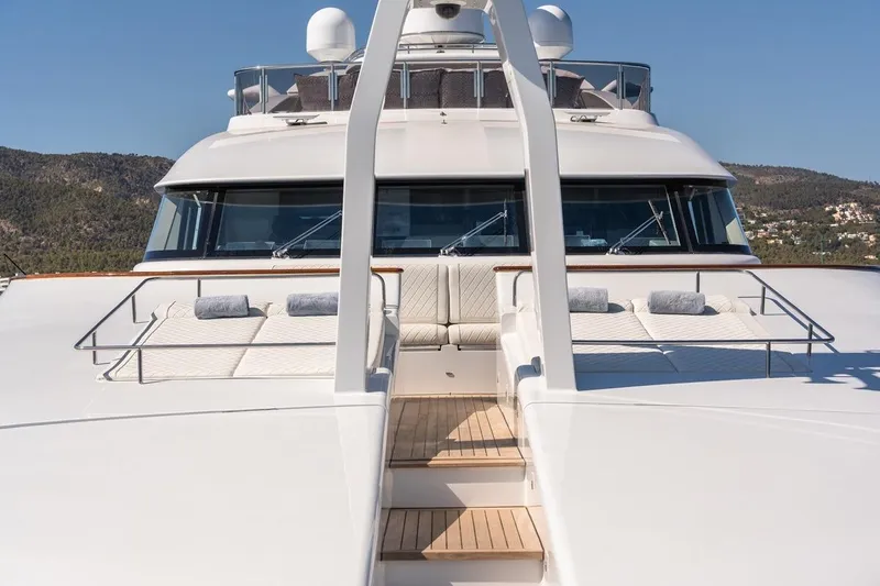 Titian Pearl Yacht Photos Pics Luxurious 2001 CRN Magnifica yacht deck with sun loungers and scenic views.