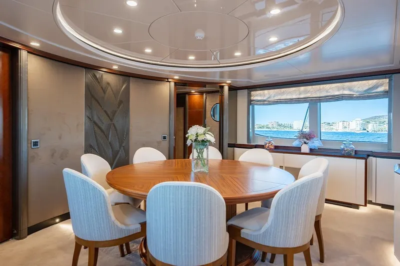 Titian Pearl Yacht Photos Pics Luxurious dining area on CRN Magnifica yacht, featuring elegant decor and panoramic sea views.