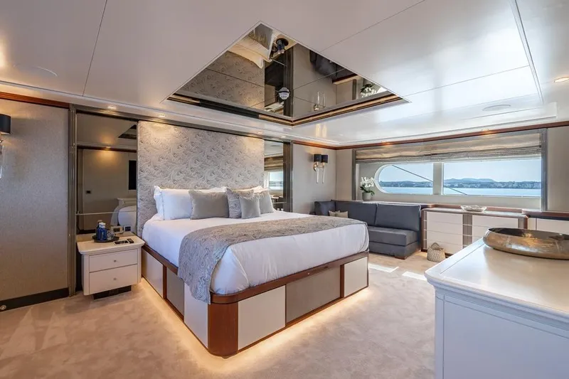 Titian Pearl Yacht Photos Pics Luxurious bedroom on 2001 CRN Magnifica yacht with elegant decor and ocean view.