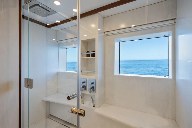 Titian Pearl Yacht Photos Pics Luxurious yacht bathroom with ocean view, featuring modern fixtures and elegant design. CRN Magnifica 2001.