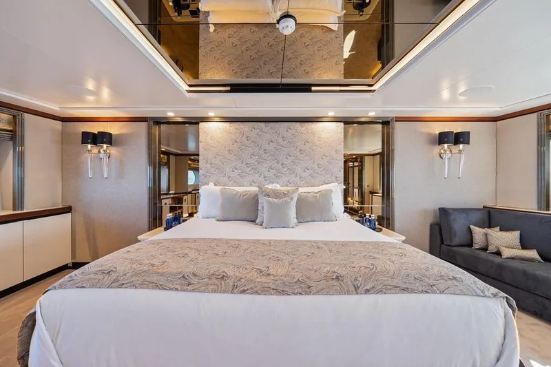 Titian Pearl Yacht Photos Pics Luxurious bedroom interior on CRN Magnifica yacht, featuring elegant decor and plush bedding.