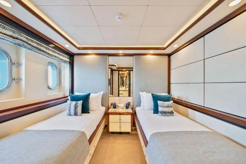 Titian Pearl Yacht Photos Pics Luxurious twin cabin on CRN Magnifica yacht, 2001 model, with elegant decor and porthole views.