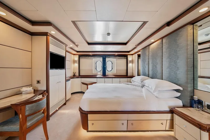 Titian Pearl Yacht Photos Pics Luxurious yacht bedroom interior on CRN Magnifica, 2001 model, featuring elegant design and modern amenities.