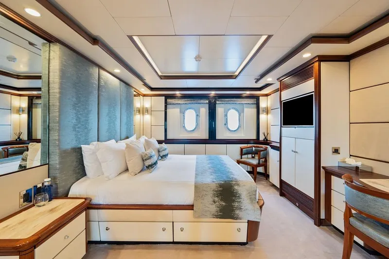 Titian Pearl Yacht Photos Pics Luxurious yacht bedroom interior on CRN Magnifica, 2001 model, featuring elegant design and modern amenities.