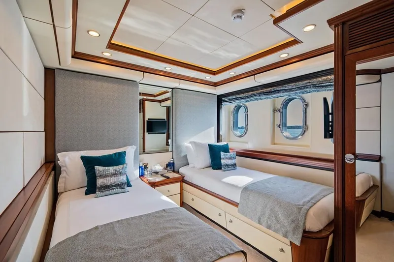 Titian Pearl Yacht Photos Pics Luxurious twin cabin on 2001 CRN Magnifica yacht with elegant decor and ocean view.