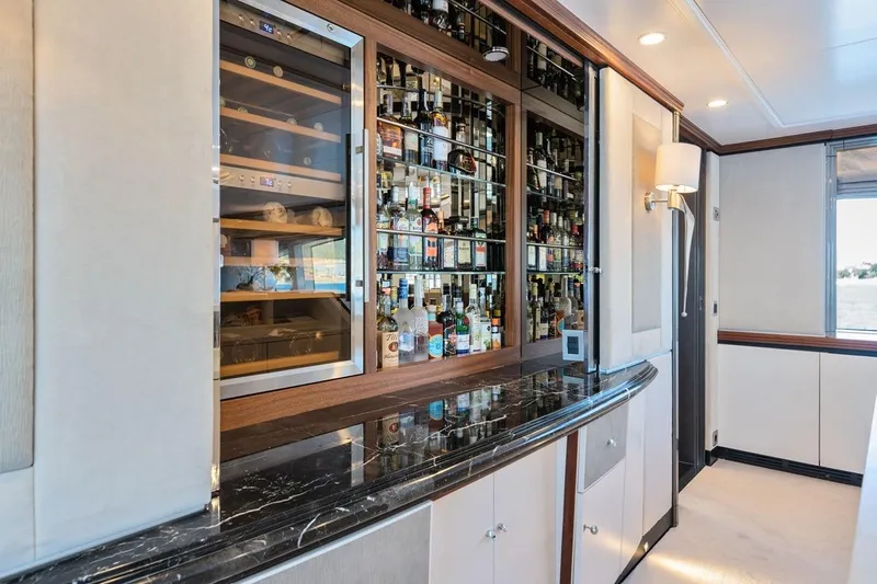 Titian Pearl Yacht Photos Pics Luxurious yacht bar interior with mirrored shelves and wine cooler, CRN Magnifica 2001.